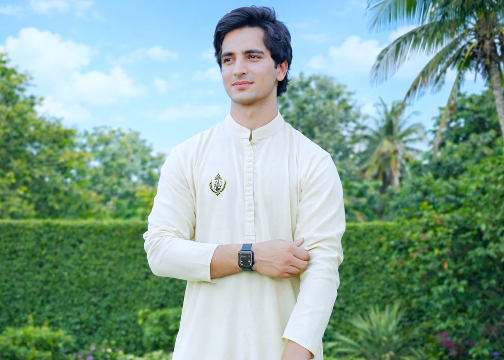 Television actor posing outdoors