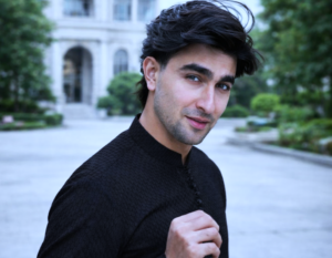 Actor in modern fashion attire