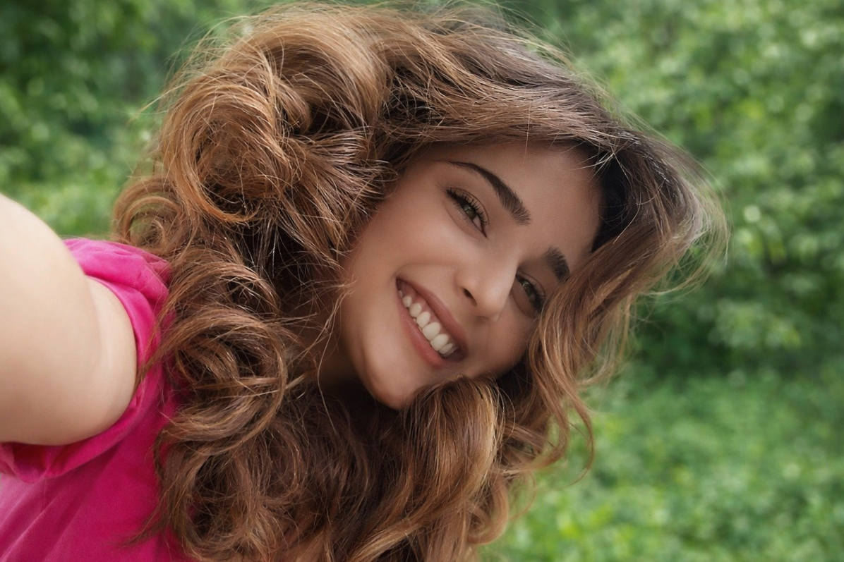 Popular actress standing in a scenic outdoor location