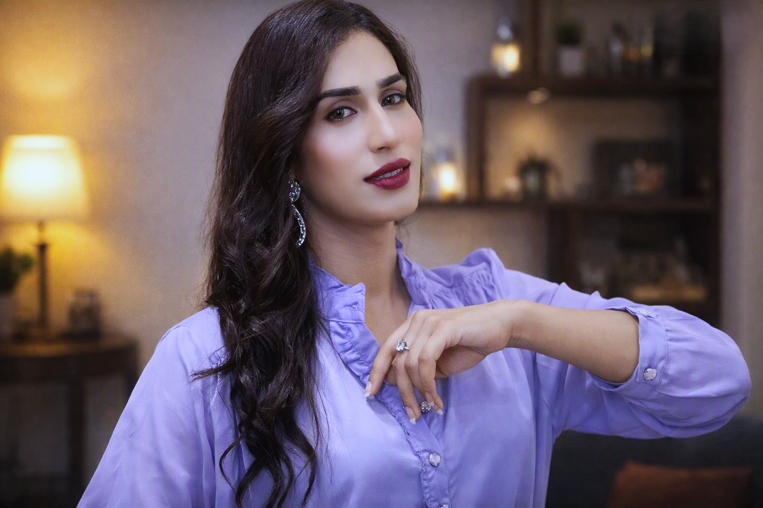 Actress in purple shirt looking elegant