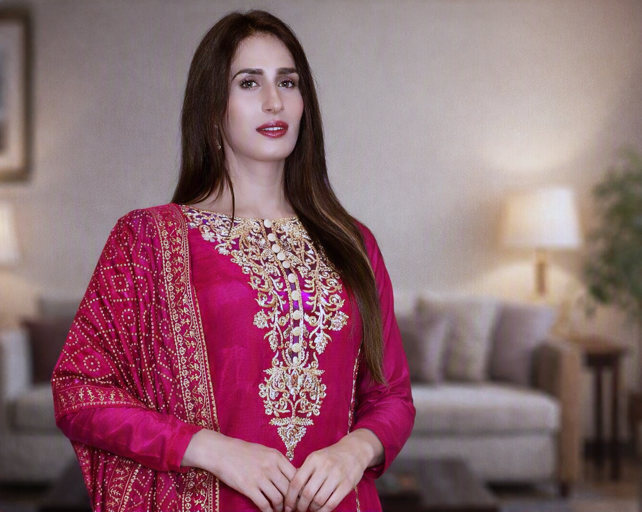 Superstar posing in magenta traditional embroidered dress