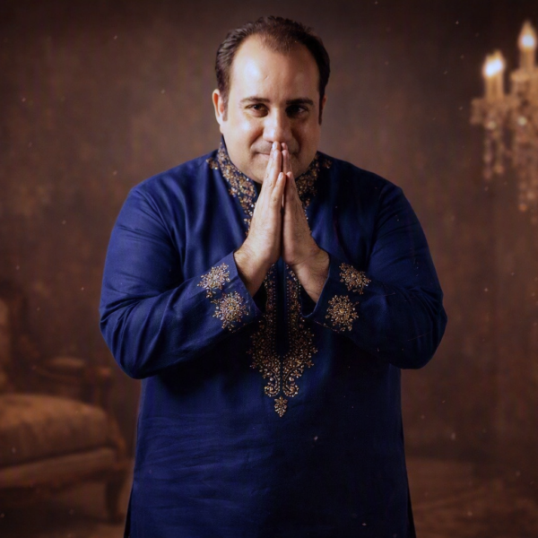 Formal portrait with folded hands and warm smile