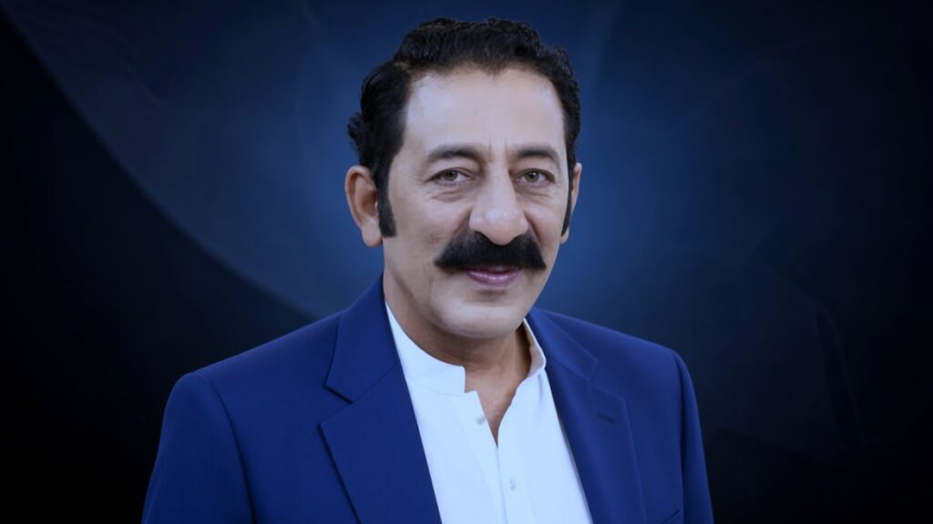 Actor blue formal suit mein muskurate huay