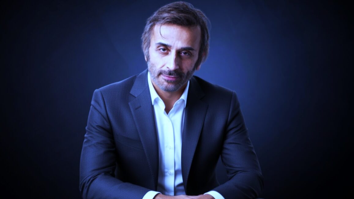 Senior drama actor in black blazer with white shirt
