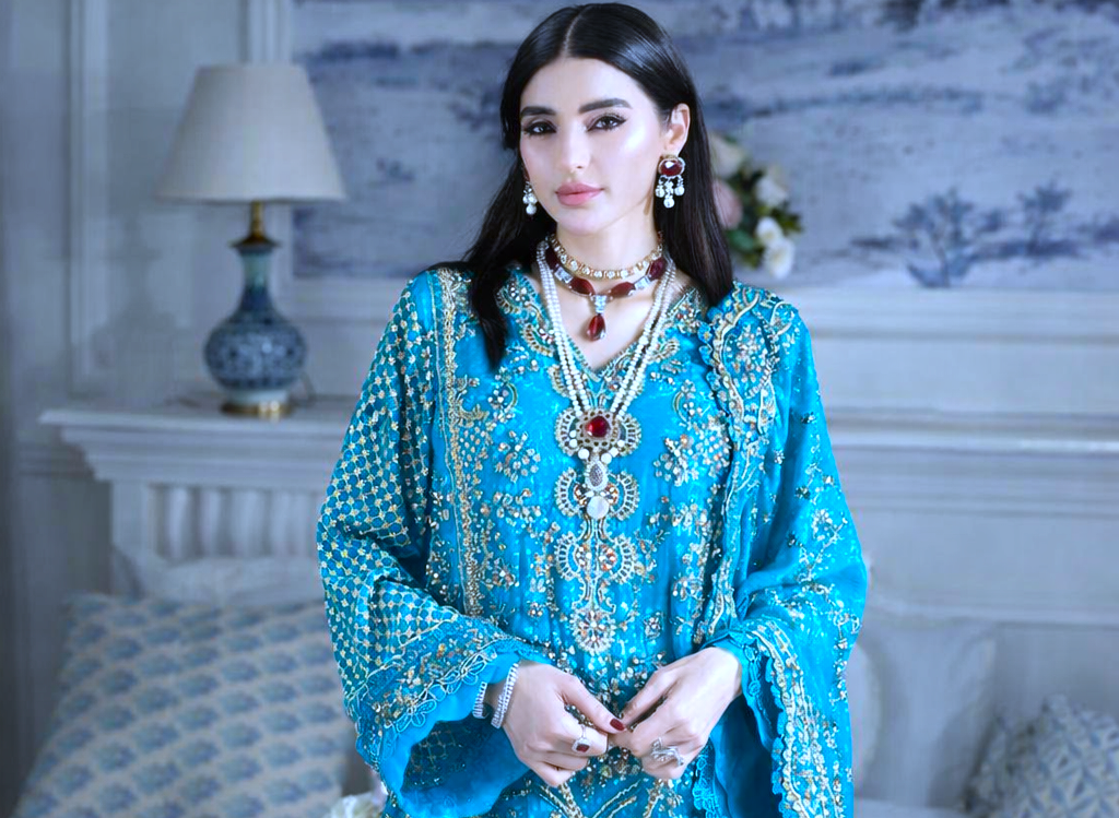 Turquoise embroidered dress mein super star ka elegant look